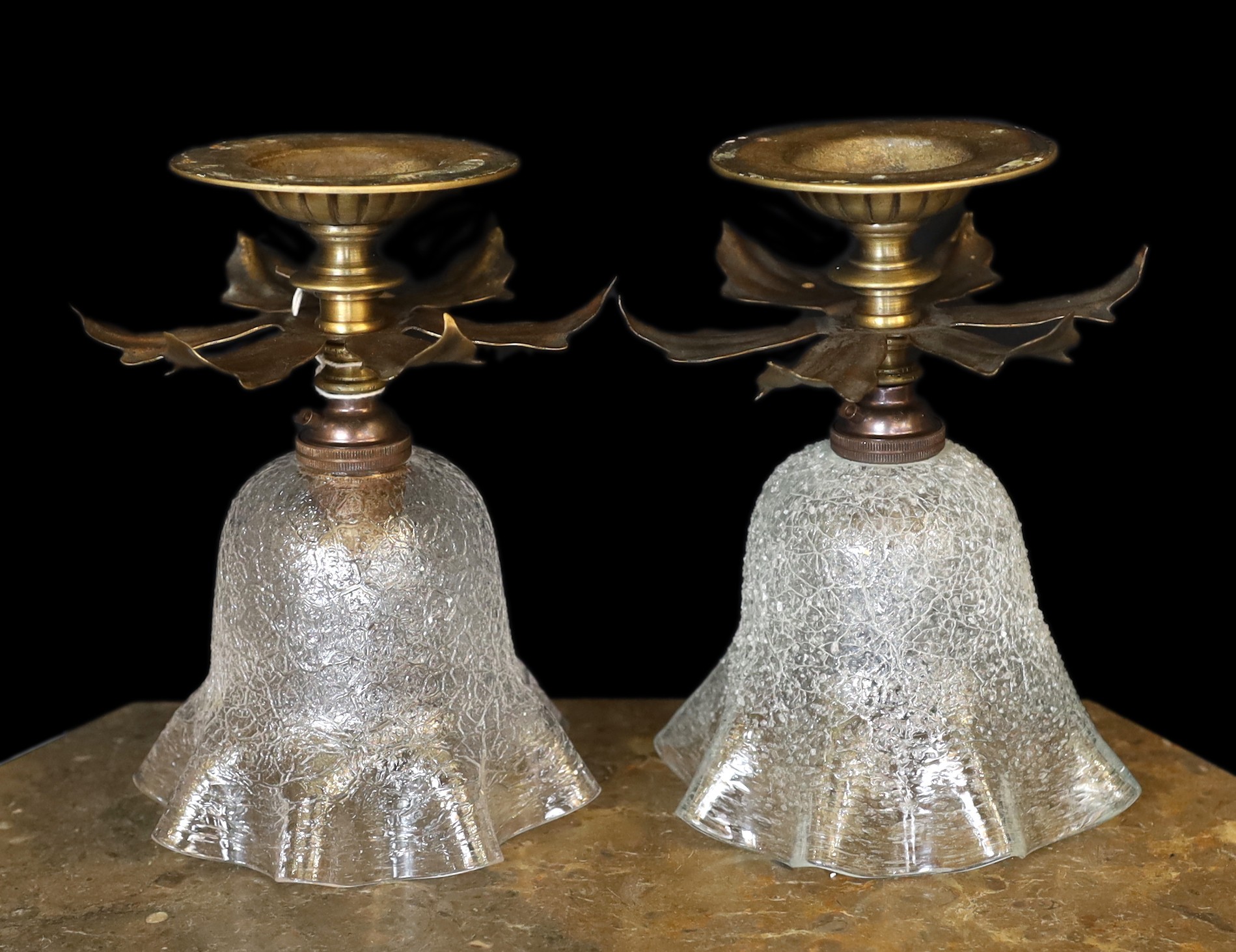A pair of 1930s English brass ceiling lights of foliate form with crackle glass shades, height 19cm